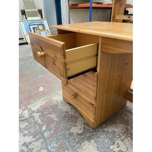 1035 - A modern pine dressing table with three drawers