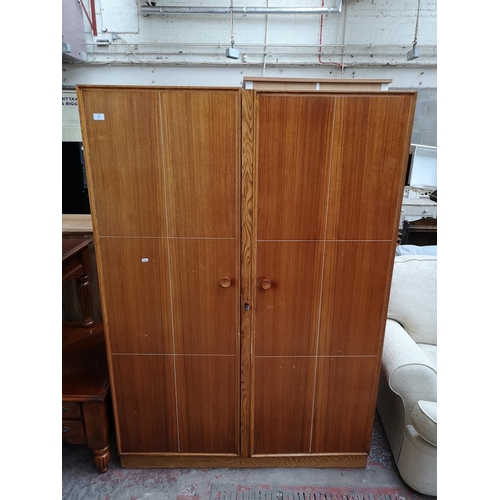 1044 - A Meredew walnut and oak double wardrobe