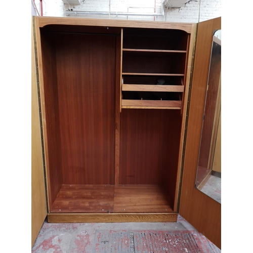 1044 - A Meredew walnut and oak double wardrobe