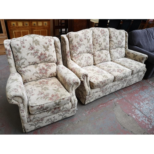 1068 - An Alstons Rutland floral upholstered two piece lounge suite comprising three seater sofa and armcha... 