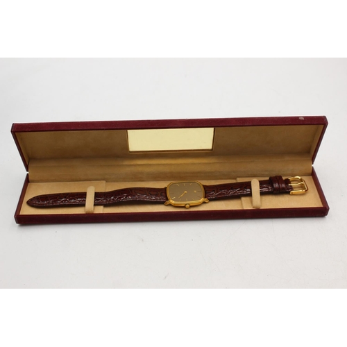 2178 - A boxed Raymond Weil Geneve gold tone quartz men's wristwatch with brown leather strap