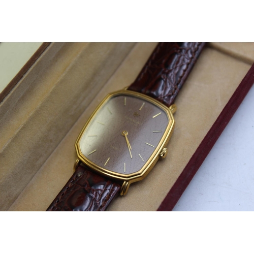 2178 - A boxed Raymond Weil Geneve gold tone quartz men's wristwatch with brown leather strap