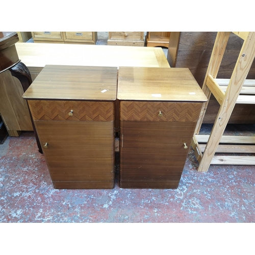 1037 - A pair of mid 20th century Uniflex walnut bedside cabinets - approx. 62cm high x 37cm wide x 35cm de... 