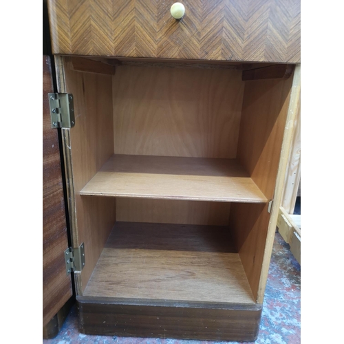 1037 - A pair of mid 20th century Uniflex walnut bedside cabinets - approx. 62cm high x 37cm wide x 35cm de... 