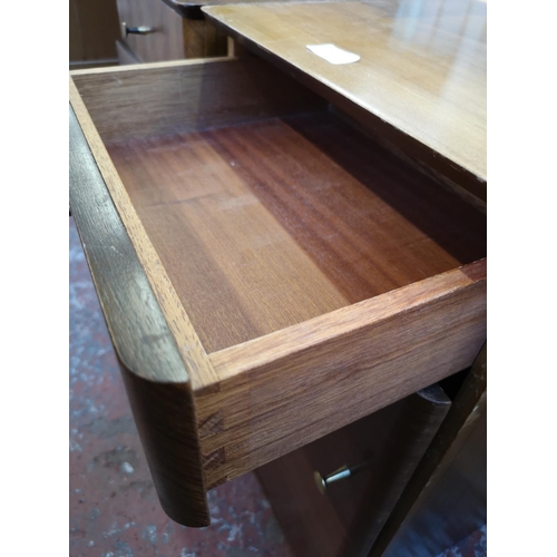 1037 - A pair of mid 20th century Uniflex walnut bedside cabinets - approx. 62cm high x 37cm wide x 35cm de... 