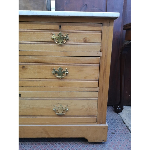 1039 - An Edwardian pine and marble top chest of two short over two long drawers - approx. 75cm high x 103c... 