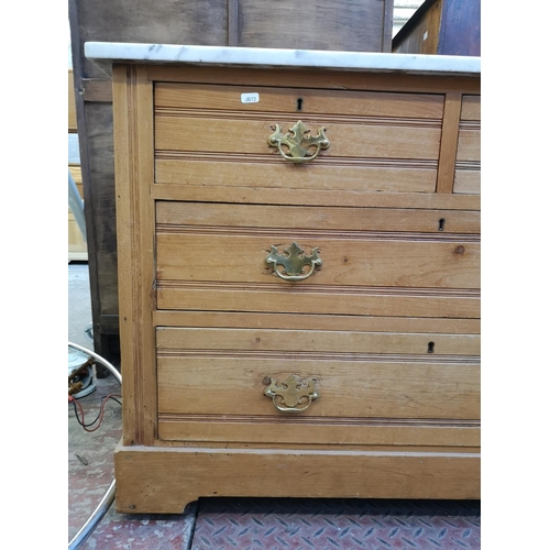 1039 - An Edwardian pine and marble top chest of two short over two long drawers - approx. 75cm high x 103c... 