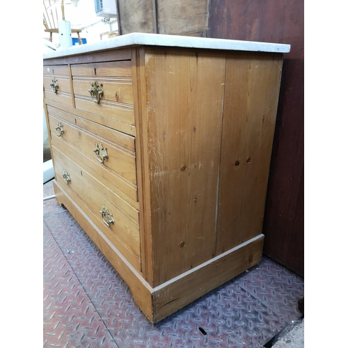 1039 - An Edwardian pine and marble top chest of two short over two long drawers - approx. 75cm high x 103c... 