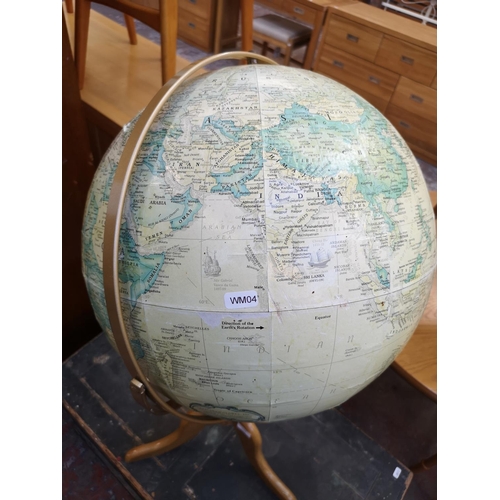 1042 - A Replogle Globes Inc. terrestrial globe on oak stand - approx. 94cm high