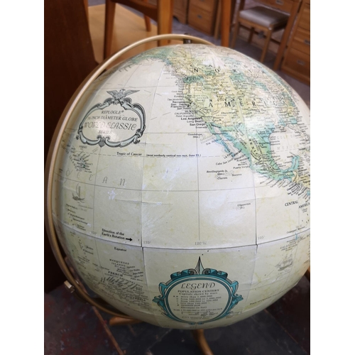 1042 - A Replogle Globes Inc. terrestrial globe on oak stand - approx. 94cm high