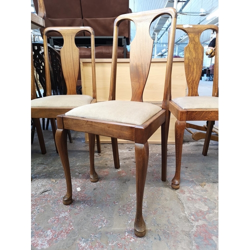 1049 - A set of eight Queen Anne style oak dining chairs