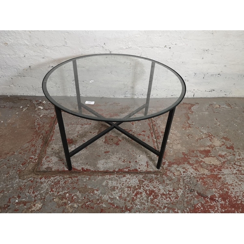 1055 - A modern black metal and glass circular coffee table - approx. 45cm high x 75cm diameter