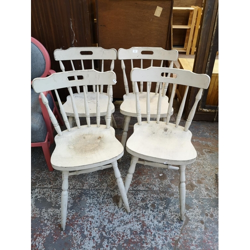 1057 - A set of four grey painted spindle back farmhouse dining chairs