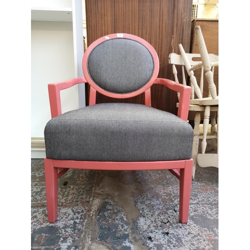 1058 - A modern pink painted and grey fabric upholstered armchair