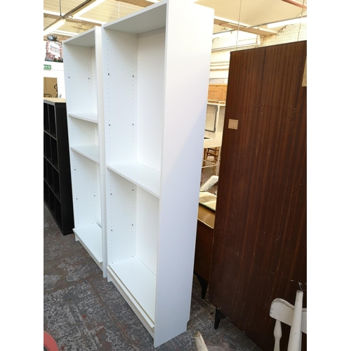 1059 - An IKEA white laminate freestanding bookcase - approx. 202cm high x 80cm wide x 28cm deep