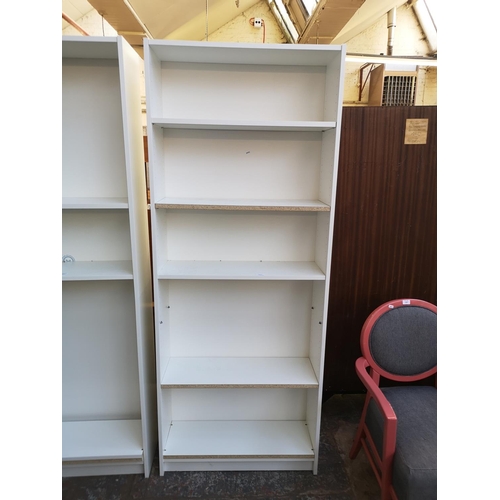 1059 - An IKEA white laminate freestanding bookcase - approx. 202cm high x 80cm wide x 28cm deep