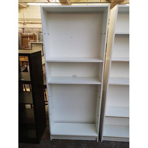 1060 - An IKEA white laminate freestanding bookcase - approx. 202cm high x 80cm wide x 28cm deep