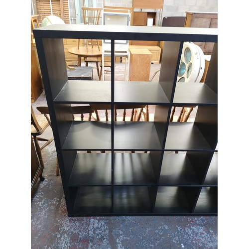 1061 - A modern black ash effect sixteen cube shelving unit - approx. 147cm high x 147cm wide x 39cm deep