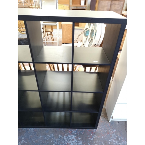 1061 - A modern black ash effect sixteen cube shelving unit - approx. 147cm high x 147cm wide x 39cm deep