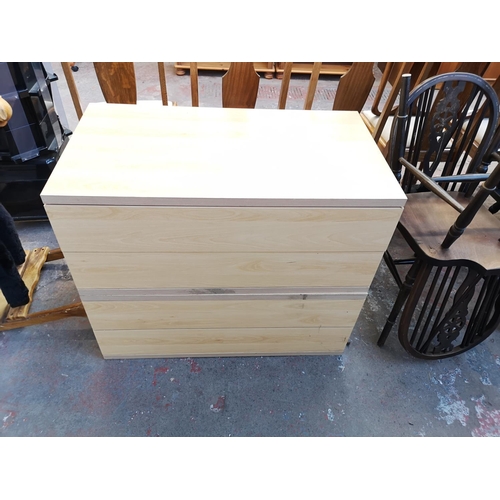 1064A - A modern beech effect chest of four drawers