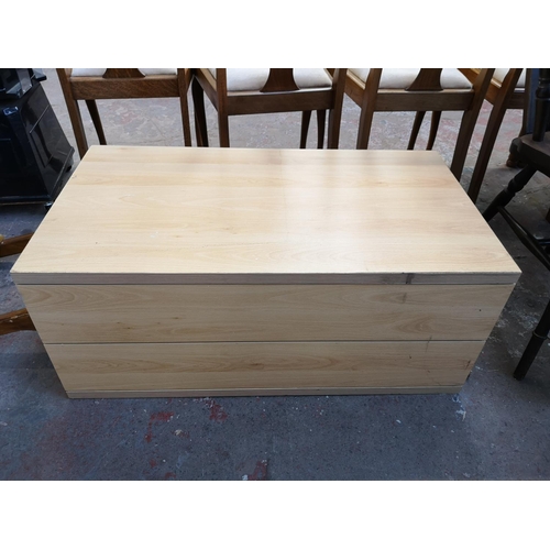 1064A - A modern beech effect chest of four drawers