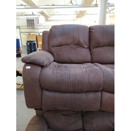 1066 - A modern brown suede reclining two seater sofa