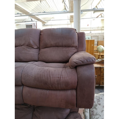 1066 - A modern brown suede reclining two seater sofa