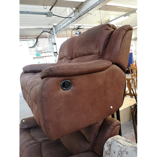 1066 - A modern brown suede reclining two seater sofa