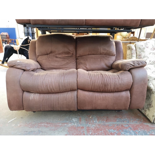 1067 - A modern brown suede reclining two seater sofa