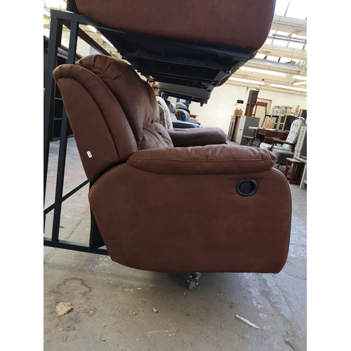 1067 - A modern brown suede reclining two seater sofa