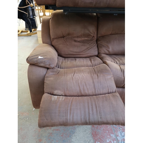 1067 - A modern brown suede reclining two seater sofa