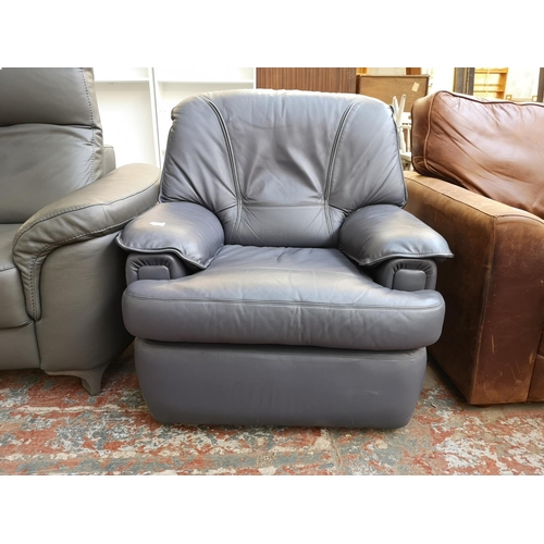 1070 - A modern grey leatherette armchair