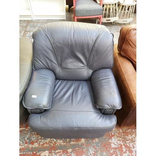 1070 - A modern grey leatherette armchair