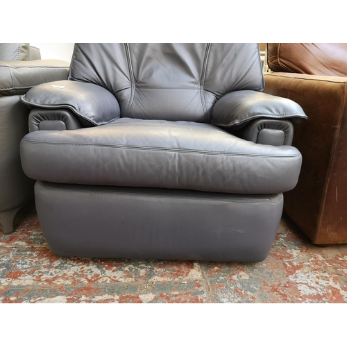 1070 - A modern grey leatherette armchair