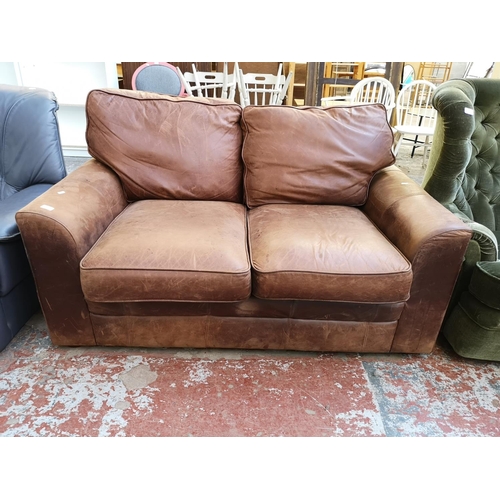 1071 - A Liberty brown leather two seater sofa