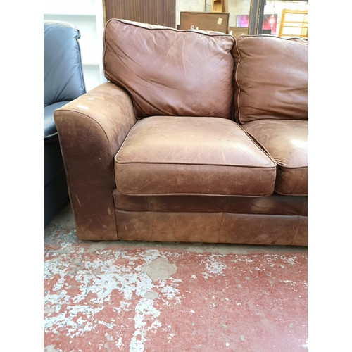 1071 - A Liberty brown leather two seater sofa