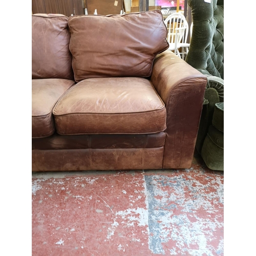 1071 - A Liberty brown leather two seater sofa