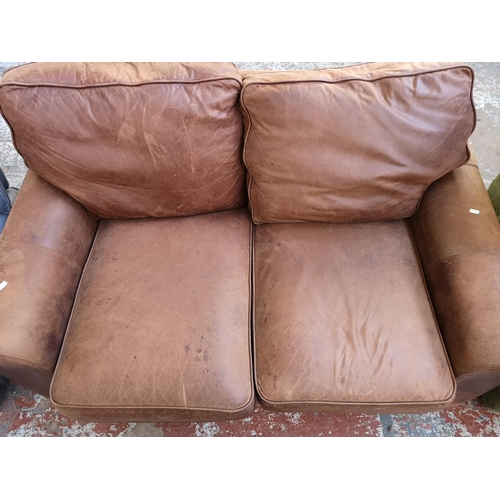 1071 - A Liberty brown leather two seater sofa