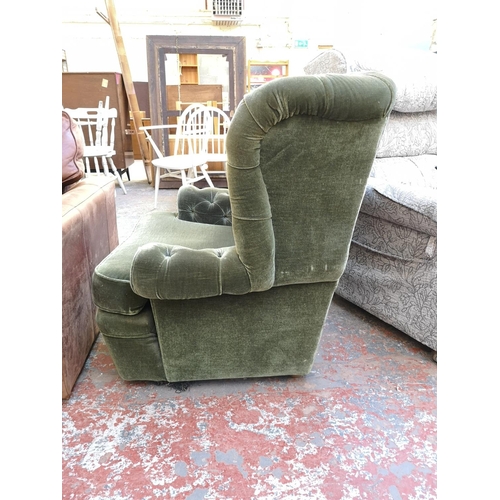 1072 - A vintage Wade green button back upholstered armchair