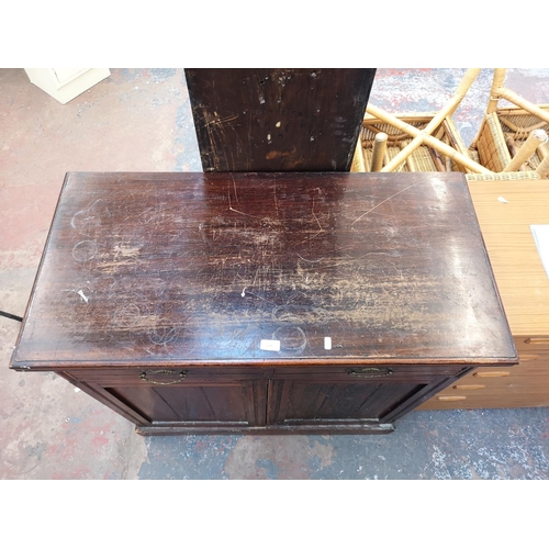 1075 - An Edwardian stained mahogany sideboard with two drawers and two lower cupboard doors - approx. 98cm... 