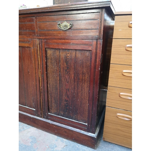 1075 - An Edwardian stained mahogany sideboard with two drawers and two lower cupboard doors - approx. 98cm... 