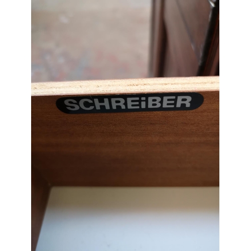 1076 - A Schreiber teak effect chest of five drawers