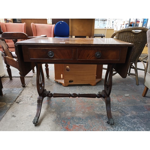 1082 - A Regency style mahogany drop leaf lyre end sofa table with two drawers