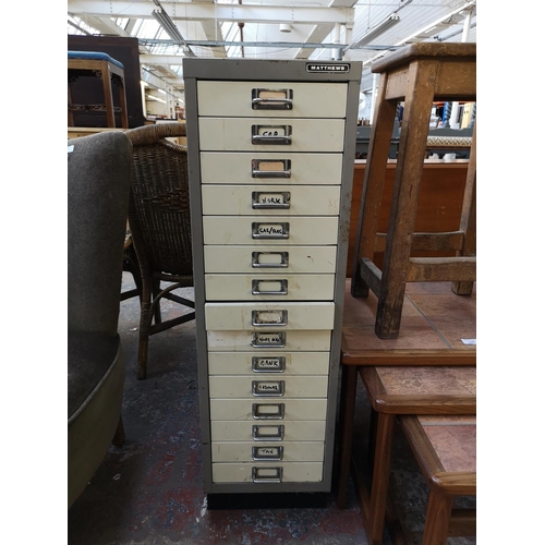 1085 - A Matthews grey and cream metal fifteen drawer office filing cabinet - approx. 95cm high x 28cm wide... 