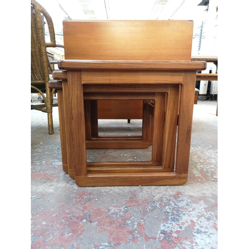 1087 - A mid 20th century teak and tiled top nest of three tables