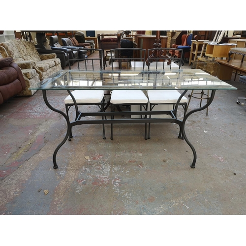 1092 - A modern wrought iron and glass top rectangular dining table and six matching chairs - approx. 77cm ... 