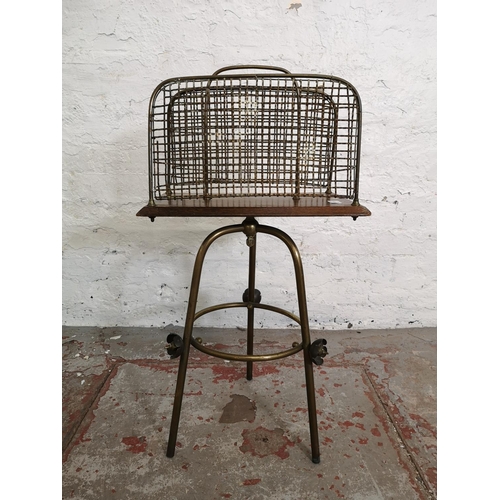 1092A - An early 20th century oak and brass adjustable magazine rack - approx. 78cm high