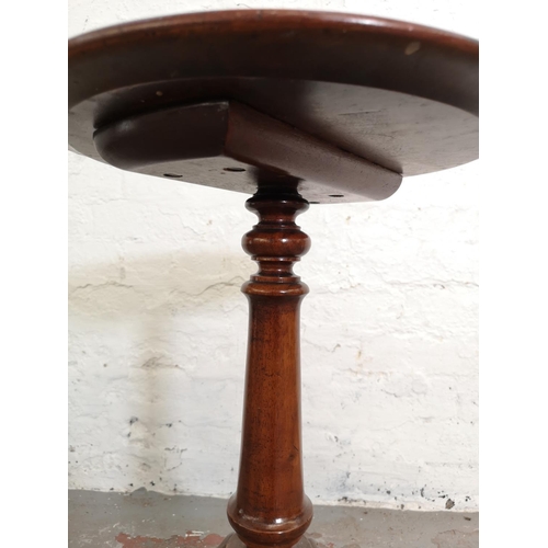 1093A - A Victorian mahogany tripod pedestal circular top wine table - approx. 61cm high x 36cm in diameter