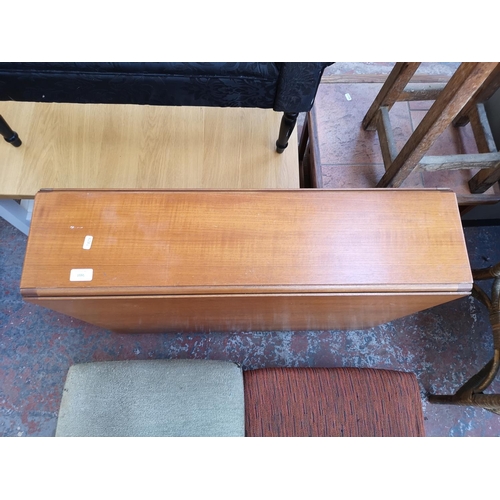 1095 - Three pieces of mid 20th century furniture, one teak drop leaf gate leg dining table, one teak and b... 