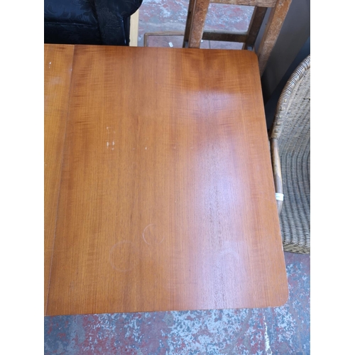 1095 - Three pieces of mid 20th century furniture, one teak drop leaf gate leg dining table, one teak and b... 